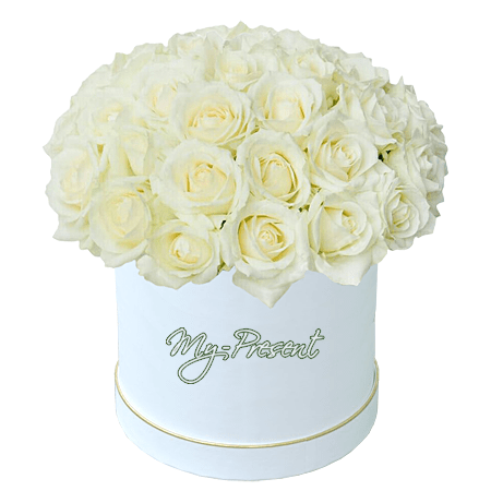 Roses blanches dans une boîte